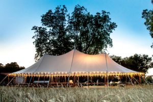 Anchor’s Aurora sheer-top tent becomes the center of attention, whether at daytime, nighttime or dusk. Photo courtesy of Oconee Events, Watkinsville, Ga., and Anchor Industries. 