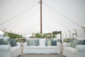 A Tidewater Tent, eucalyptus and a natural color palette combine for an inviting, clean  and classic look  for this wedding. Photo: Matthew Land Studios