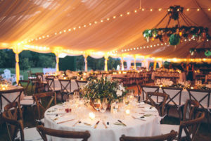 Unique floral chandeliers adorn the draped ceiling of this 40-by-120-foot tent at Estancia Culinaria, Redland, Fla. Photo: Daniel Lateulade Photography  in partnership with Fiction Events and  Mena Catering