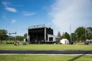 Major entertainment acts often tour with their own staging system but require auxiliary tents for vendors, VIP guests, and first aid. Photo: Julie Drewes, Wartburg College