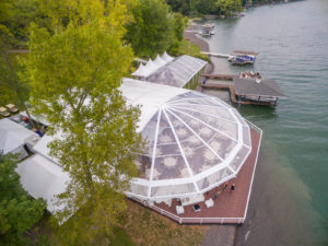 This September wedding called for a total of 20,000 square feet of flooring, including a patio that extended over the lake. Photo: Mark DiOrio Photography