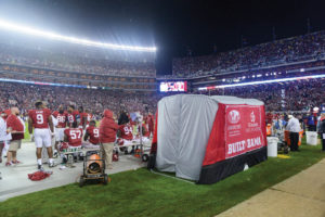 A medical privacy tent developed by University of Alabama students in collaboration with Crimson Tide Athletics sits on the Alabama sideline inside Bryant-Denny Stadium during a game with LSU on Nov. 7, 2015. Photo by Jeff Hanson, University of Alabama. 