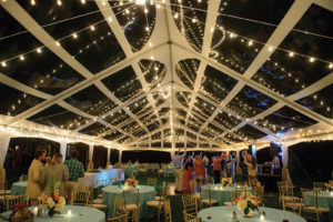 At night, a party under a clear-top tent is a party under the stars. Installation by Purdon’s Rental and Sales. Photo by Adam Padgett Weddings.