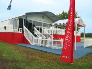 Hospitality chalets featured a red, white  and blue color scheme  on their exterior throughout the course; interior decor was tailored to the individual sponsors renting each chalet. 
