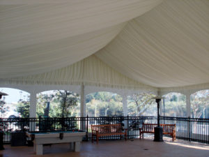 Sidewalls with bay windows are showcased by a pleated tent liner in this tent by Olympic Tent. Photo courtesy of Event Resource Group.