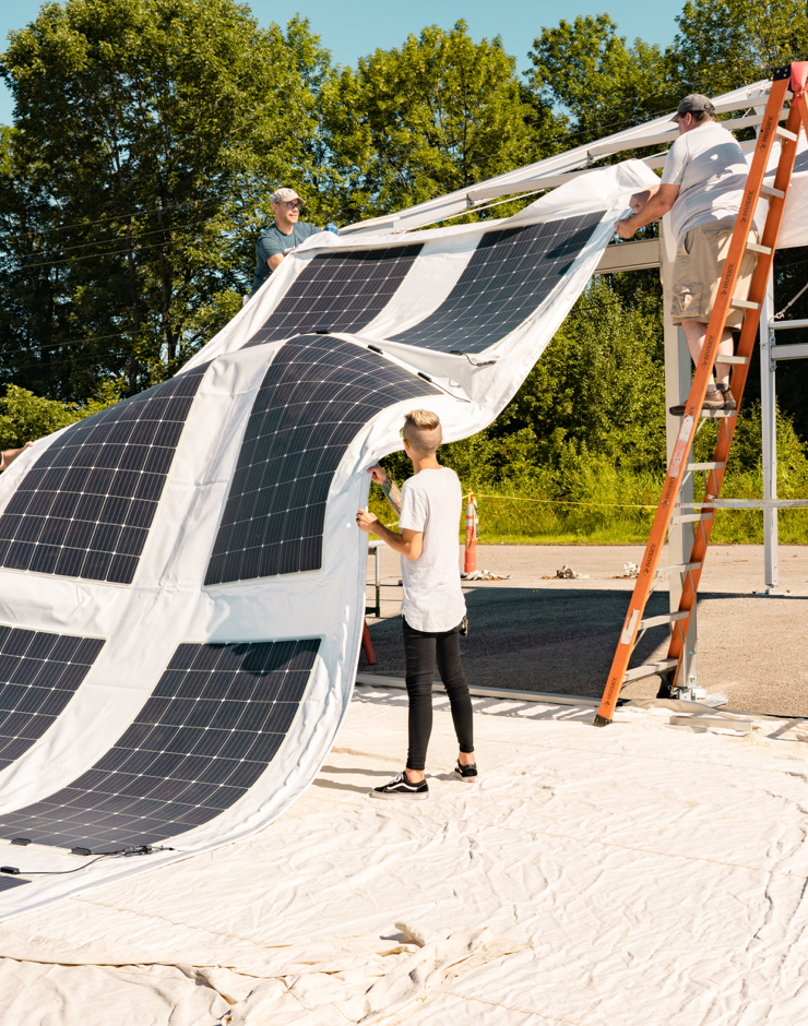 Flexible solar panels are being installed on tent roofs.