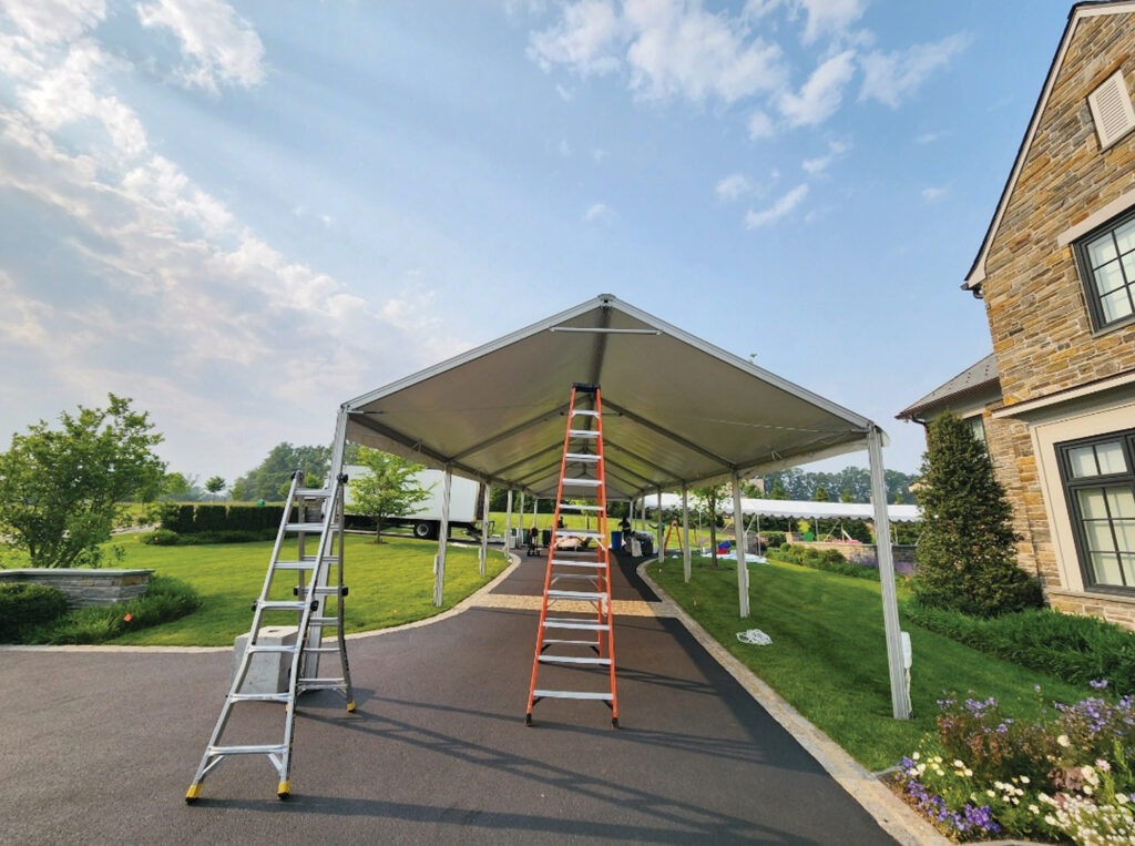 Approximately 90% of the SJPR staff use ladders at some point during the workday, with installs ranging from small homeowner events all the way up to huge festivals, concerts and sporting events. Photo courtesy of South Jersey Party Rentals.
